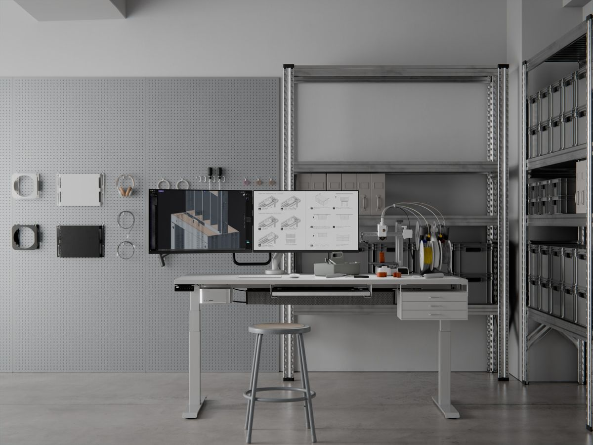 A workshop interior with a workbench, shelving and metal cabinetry